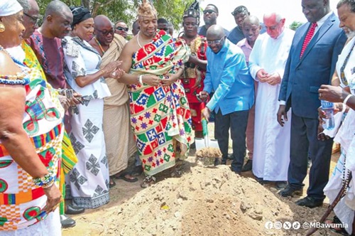 Dr Mahamudu Bawumia (with shovel) flanked by King Tackie Teiko Tsuru, the Ga Mantse, and  Rev. Father Campbell, cutting the sod for the commencement of the project