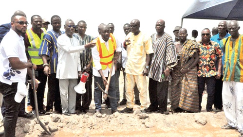 Kojo Oppong Nkrumah (with mattock), Minister of Works and Housing, performing the sod-cutting ceremony at New Bakpa in Central Tongu
