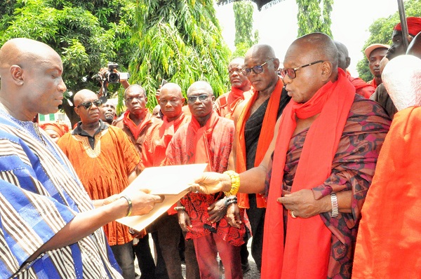 Togbe Adzie Lakle Howusu XII (right), Awafiaga of Asogli, presenting the petition to Augustus Awity, Chief Director of Volta Regional Coordinating Council