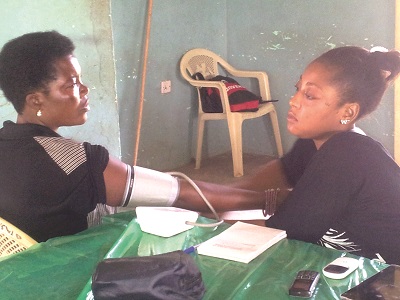  A patient  receiving medical treatment from a member of the screening team.