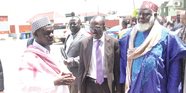 The Communications Manager of Zoomlion, Mr Robert Coleman (left), interacting with the Chairman of the Advisory Council of the National Chief Imam, Sheikh Shaib Abubakar (right), during the visit. With them is the Director of Administration of Zoomlion, Mr Emmanuel Okomeng (middle).