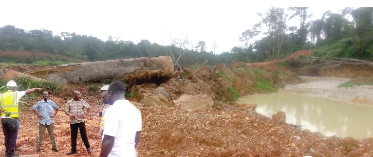 Officials of the  Mining Department of the EPA at the site of the polluted Ayensu stream.