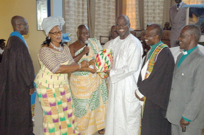 • Mrs Hanna Edusei Peasah (2nd from left), wife of the Tafohene, presenting one of the parcels to Mr J.B. Danquah Adu (3rd from right). Looking on admiringly are Rev. Sam Asiama Koranteng (left), the Old Tafo Akyem District Minister of the PCG; Dr Kwasi Ofori-Frempong, Senior Presbyter of the church, and two clergymen of the Bethel Congregation of the Methodist Church, Old Tafo Akyem , Very Rev. Kwadwo Agyenim Boateng (2nd from right) and Very Rev. (Rtd) Okyere Adarkwa (right), who graced the occasion. Picture: Takyi Boateng