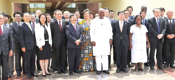 President Mahama in a group photograph with the Japanese business delegation after the meeting at the Flagstaff House in Accra.