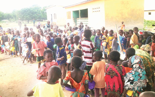 Pupils of Kpongu Kindergarten queue for food