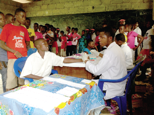 Participants in the 2013 vacation camp undergoing free medical screening. Picture: VICTOR KWAWUKUME