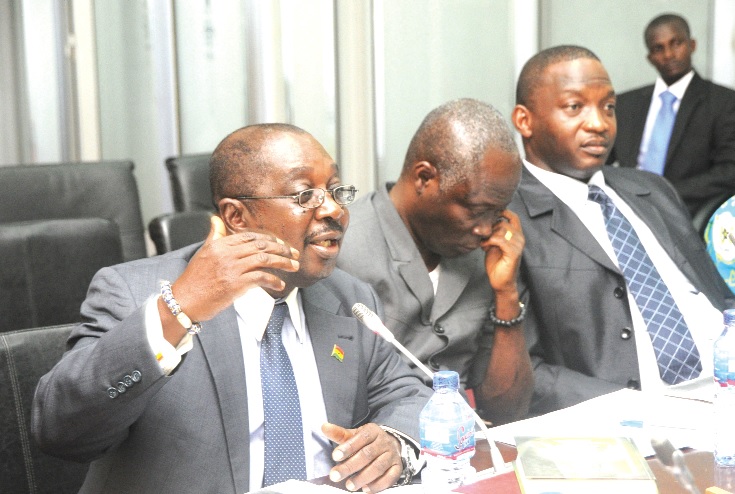 Nana Kwame Ofori Amanfo (left), a Deputy Chief Executive Officer, Ghana Trade Fair Company giving explanations to the Public Accounts Committee at the Parliament House in Accra. Also with him are Nii Lante Vanderpuye (2nd left), a Deputy Minister for Trade and Industry, and Mr Kolugu Maminare (right), Director, Finance of the ministry. 