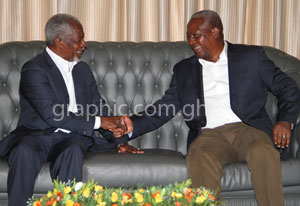 President Mahama in a handshake with Mr Kofi Annan during a courtesy call at the Flagstaff House