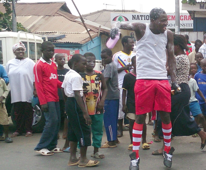 A resident of the community jumping with joy after the declaration of the judgement.