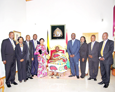 Asantehene Otumfuo Osei Tutu II (middle) with members of the board and management of Sinapi Aba Savings and Loans.
