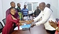 Nana Osei-Adjei (right), NPP parliamentary aspirant for New Juaben North, presenting his nomination papers to Dorcas Akoto Donkor, the New Juaben North Municipal Electoral Commission Officer