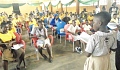 A pupil of the Yilo State Basic School reading a text to the admiration of the participants