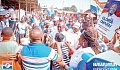  Dr Mahamudu Bawumia (arrowed), flag bearer of NPP, and Gloria Owusu (right), NPP parliamentary aspirant for the Trobu Constituency, interacting with traders at the Pokuase market