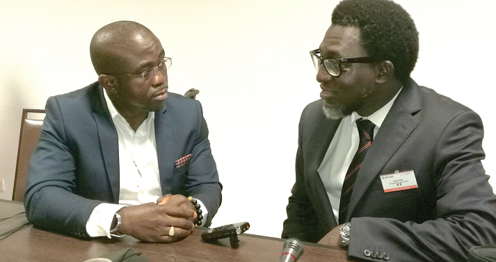 Mr Segun Adaju (right) speaking to Charles Benoni Okine, Deputy Editor, Graphic Business.