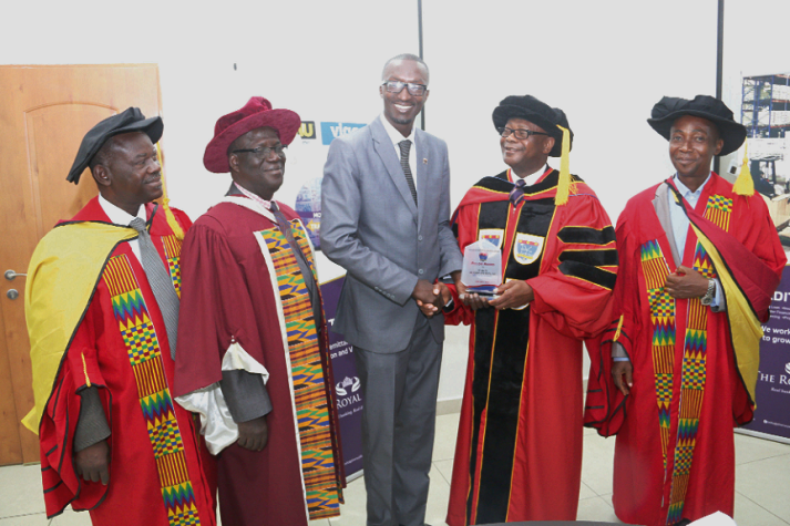 Chief Executive Officer (CEO) of The Royal Bank, Mr Robert Kow Bentil receiving his award.