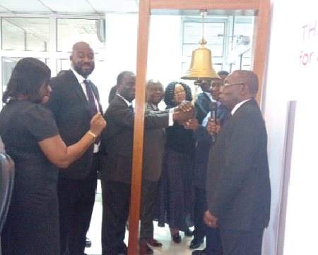 Representatives from the Ghana Stock Exchange and Ghana Home loans tolling the symbolic bell