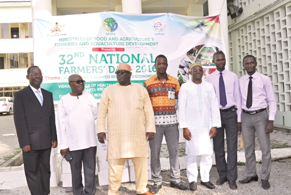 Maxwell Seth Awuku (2nd from Right) joined by colleague, Emmanuel Kwasi Anim (Extreme Right) to pose in a group photo with Alhaji Mohammed-Muniru Limuna, Dr. Yakubu Ahmed Alhassan and top Directors of MOFA after the presentation