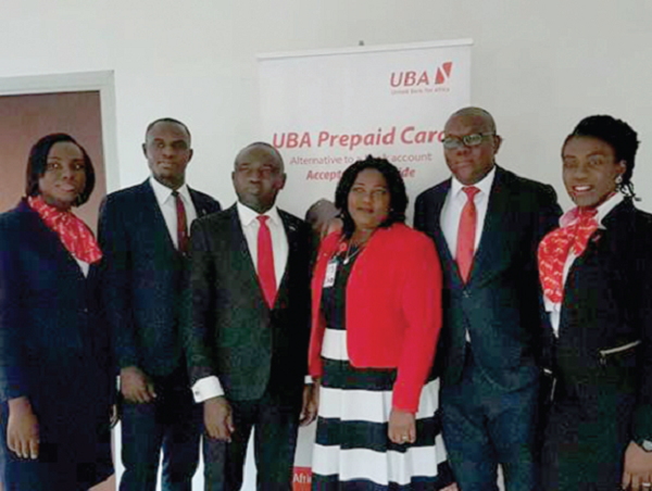 Richard Ahiagble (left), Head of Corporate Communications-Airtel Ghana, Theresa Adade (2nd from left), Head of Operations, Airtel Money, with Johnson Olakunmi (middle), Head, Digital Banking Sales and his team from UBA