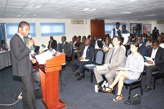 Mr Sampson Akligoh (left), Director of the Financial Sector Division  of the Ministry of Finance, addressing participants the workshop in Accra. Picture: GABRIEL AHIABOR