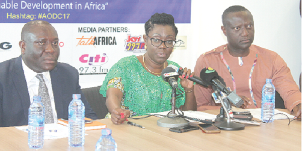 Mrs Ursula  Owusu-Ekuful (middle) launching the AODC 2017. With her are Messrs Vincent  Sowah Odotei (left) and  Jeffrey Konadu Addo