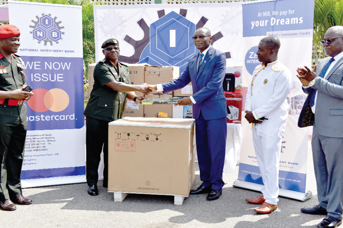  Mr Charles Wordey (3rd right) handing over the equipment to Brigadier General Thomas Oppong-Peprah.