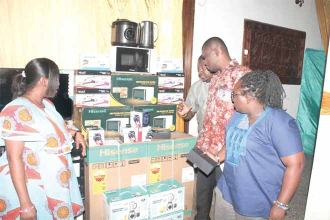 Mr Mustapha Ussif (2nd right), Mr Henry Nana  Boakye (3rd right), Deputy Executive Director of Operations, NSS, and Dr Gifty Oware-Aboagye, Deputy Executive Director of Finance Administration, NSS, inspecting the products. Looking on is Mrs Sandra Patterson (left), Head of Administration at Sun Electronics Limited, Hisense Ghana. Picture: Maxwell Ocloo