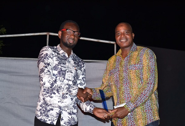 The Chief Executive Officer of Afro-Arab Group of Companies, Alhaji Abdul Salamu Amadou (left) receiving his award