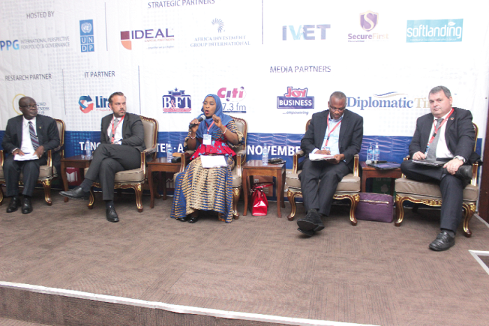 Hajia Hanatu Abubakar explaining a point while Mr Butek (2nd left) and other members of the panel listen.