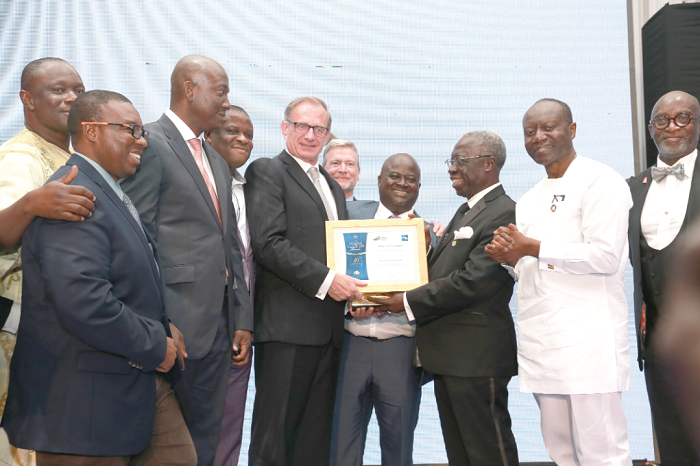 Mr Gary Goldberg (3rd left), President and Chief Executive Officer of Newmont Ghana Limited, receiving the Overall Winner award from Mr Yaw Osafo-Maafo. With them are Mr Ken Ofori-Atta (2nd right), the Finance Minister and Mr Yofi Grant (right).