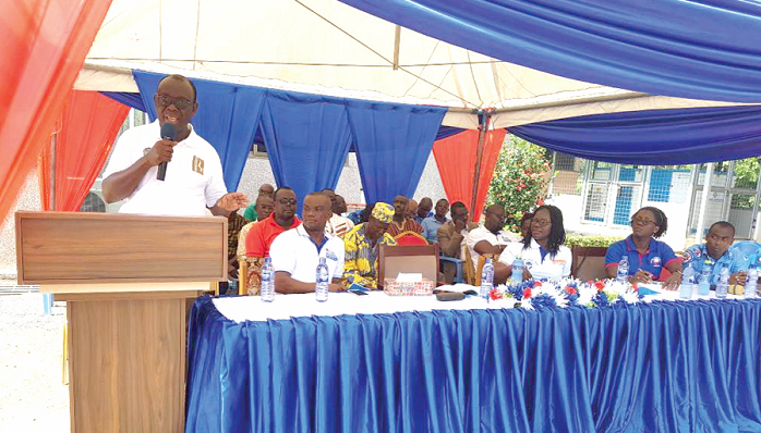 Nana Agyepong (in polo shirt) delivering his address 