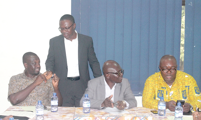 Dr Simon Bawakyillenuo (left), a Senior Research Fellow at the Institute of Statistical, Social and Economic Research (ISSER), Dr Charles Ackah (2nd left), Head of Economics Division, ISSER, Prof. Felix Asante (3rd left), Director of ISSER, and Prof. Robert Darko Osei, Associate Professor at ISSER, interacting among themselves. Picture: Maxwell Ocloo