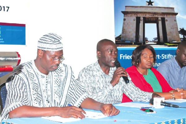 Dr Kennedy Achakoma (2nd left), addressing participants at the conference. With him are Mr Abdul Karim Ouedraogo (left), and Mrs Olga Silimi (3rd left) of Congress of Trade Unions. Picture: Maxwell Ocloo