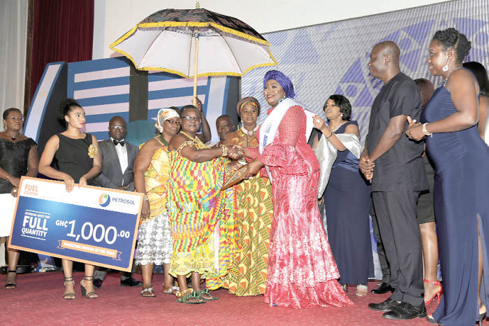 Nana Adwoa Gyamfua II (left), Queen of the Kwahu Traditional Area, presenting the Marketing Woman of the Year 2016 award to Mrs Abiola Bawuah (right), CEO, UBA Ghana.