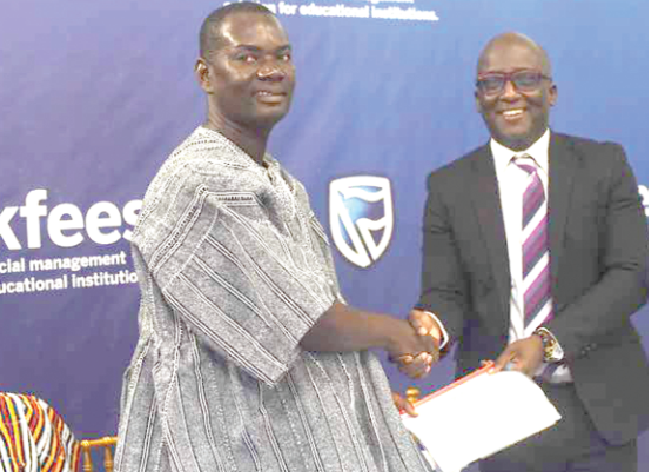  Nana Dwemoh Benneh (right) in a handshake with Mr Eric Appiah after both sides signed the MoU