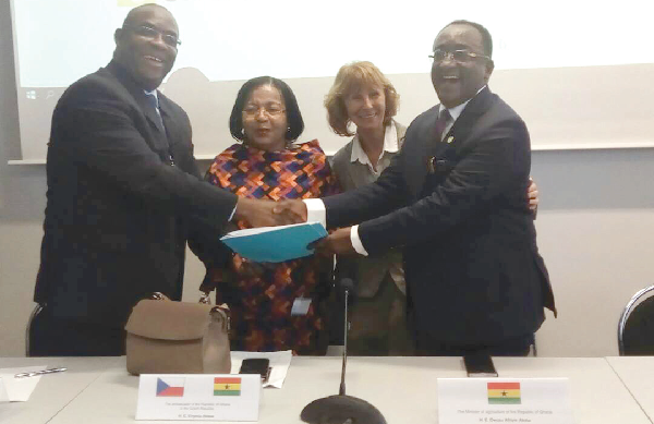 Dr Karl Laryea (left) exchanging the signed documents of the agreement with Dr Owusu Afriyie Akoto. Those with them are the envoys of Ghana and the Czech Republic