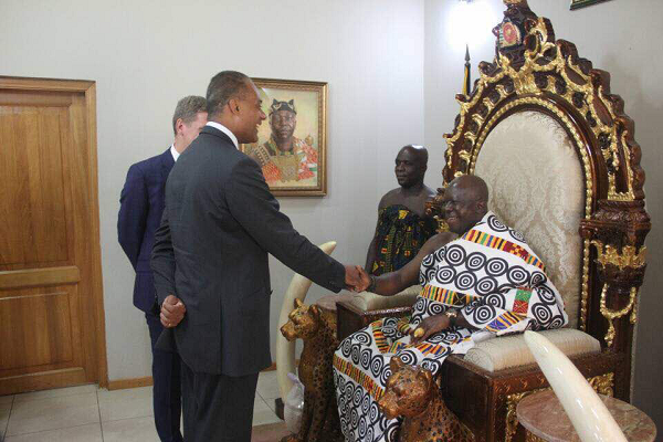 Mr Adam Afriyie (left), the British Prime Minister's Special Trade Envoy and Member of British House of Commons, exchanging pleasantries with Otumfuo at Manhyia Palace