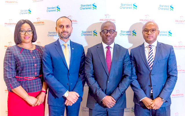 Mr Gautam Duggal (2nd left), Regional Head of Wealth Management in-charge of Africa, Middle East and Europe at Standard Chartered, Mr Mokobe Aryee (2nd right), Prudential Life, and other executives of the two institutions at the media briefing in Accra.