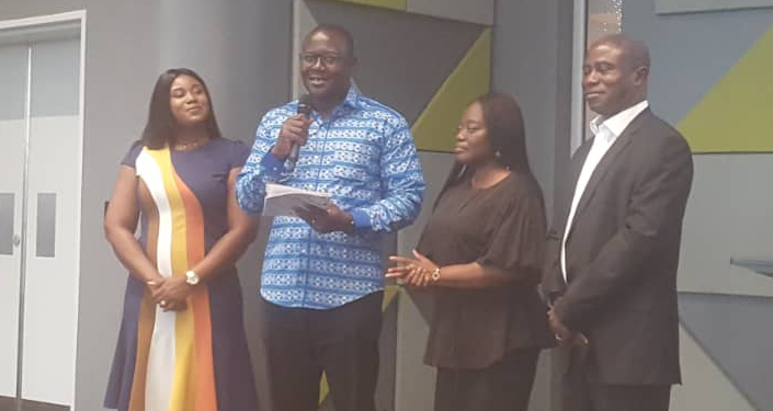 Mr Samuel Horam Yaro (in blue shirt) launching the report together with some officials of Ecbank Ghana and NiBS 