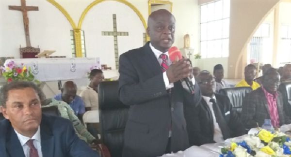 Mr Francis Denteh (standing), Board Chairman, addressing shareholders at the meeting