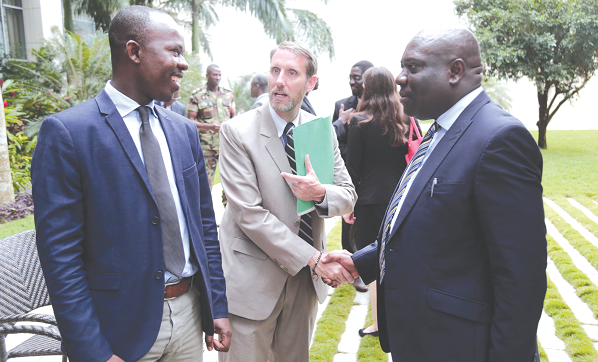  Mr Tom Lyons (middle), US Embassy official, interacting with Mr Albert Antwi-Boasiako (left), the National Cyber Security Advisor, and Mr Vincent Odotei Sowah, a Deputy Minister of Communications, after the workshop. Picture: EMMANUEL ASAMOAH ADDAI