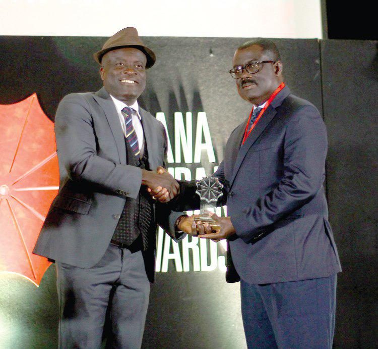 The Managing Director of State Insurance Company Limited, Mr Stephen Oduro, receiving the Brand of the Year Award from Mr Titus Glover (left), Deputy Minister of Transport. Picture: NII MARTEY M. BOTCHWAY