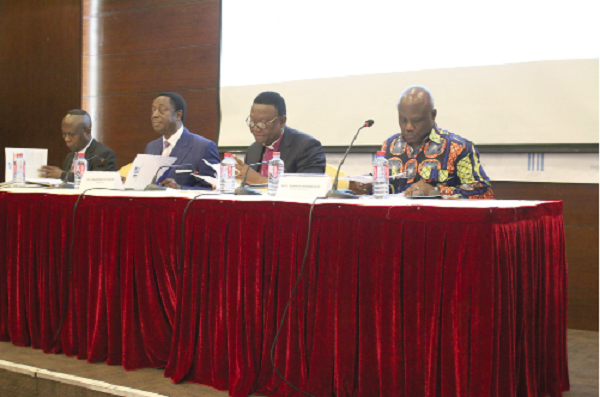 Prof. Newman Kusi (right) addressing the forum. With him are Prof. Emmanuel Asante (2nd right), Dr Kwabena Duffuor (2nd left) and Dr John Kwakye (right)