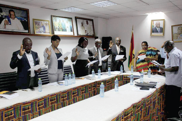 Nana Dr Appiagyei Dankawoso I (in cloth) swearing in the members of the committee