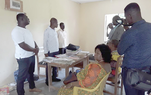 The head Teacher of the school, Mr Ali john (middle) briefing the delegation 