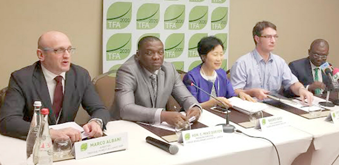 Mr Abraham Baffoe (right), the Africa Regional Director of Proforest, explaining a point. With him are Dr Christopher Stewart (2nd right), Head of CRS, Olam International; Naoko Ishii (middle), CEO and Chairperson, Global Environment Facility, and other dignitaries