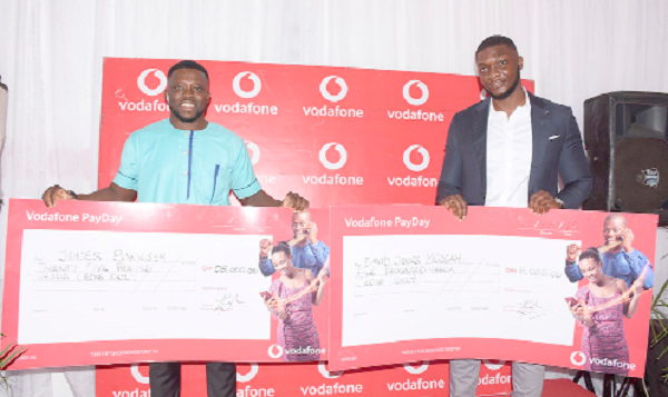 Mr Jones Baneseh (left) and Mr David Jones Mensah (right) holding their dummy cheques