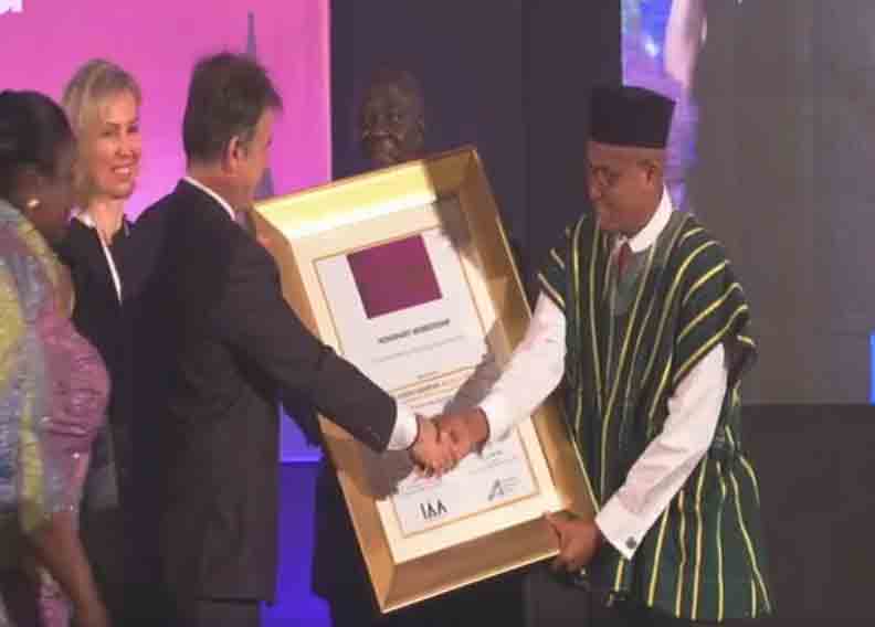 The Minister of Information, Dr Mustapha Abdul-Hamid receiving the honorary membership on behalf of President Akufo-Addo from IAA Chairman and World President, Felix Tataru