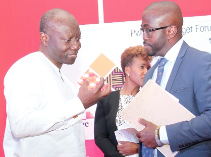 Mr Ken Ofori-Atta (left) speaking to Mr Charles Benoni Okine, the Assistant Editor of the Graphic Business, after the forum. Picture: BENEDICT OBUOBI