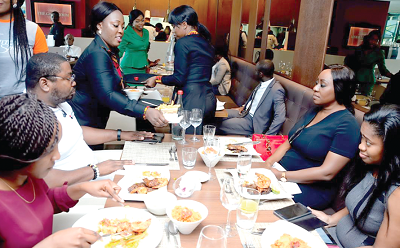 Waitresses attending to guests at the launch