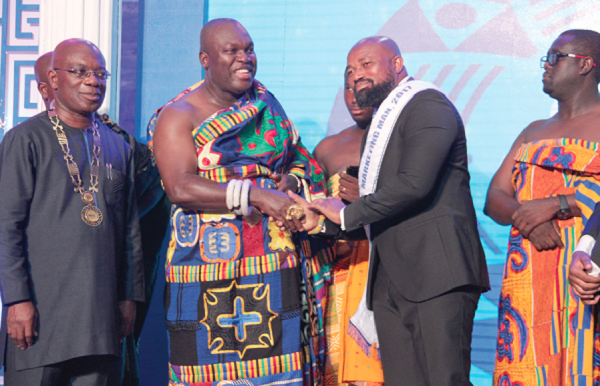 Dr Daniel McKorley (3rd left), CEO, McDan Group of Companies being congratulated by Odeneho Kwafo Akoto III, Akwamuhene, after receiving the Marketing Man of the Year award. With them is Mr Kojo Mattah (left),  President, CIMG. Picture: BENEDICT OBUOBI